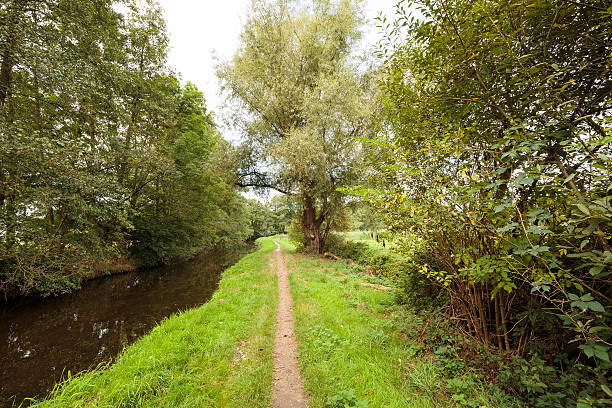 istock Tranquil Creek Schwalm with Hiking trail / Germany 605991100