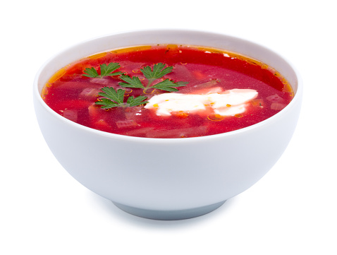 Hot borsch in a white bowl isolated on a white background