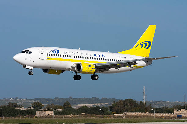 Italian Airlines 737 on short finals. Luqa, Malta - March 13, 2008: Poste Italiane (Mistral Air) Boeing 737-36E(QC) mistral wind stock pictures, royalty-free photos & images
