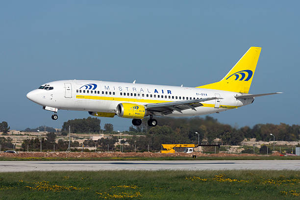 Italian Airlines 737 on short finals. Luqa, Malta - March 13, 2008: Poste Italiane (Mistral Air) Boeing 737-36E(QC) mistral wind stock pictures, royalty-free photos & images