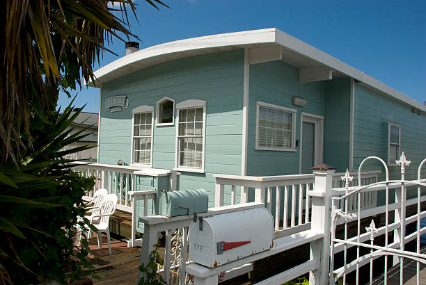 beautifully restored turquoise, private house boat in Sausalito Sausalito, USA - May 13, 2016: Exterior view of a beautifully restored turquoise, private house boat in Sausalito, in May 2016 sausalito stock pictures, royalty-free photos & images