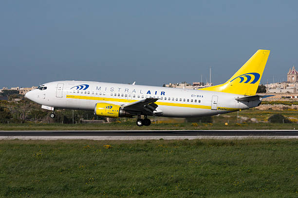 Italian Airlines 737 on short finals. Luqa, Malta - March 13, 2008: Poste Italiane (Mistral Air) Boeing 737-36E(QC) mistral wind stock pictures, royalty-free photos & images