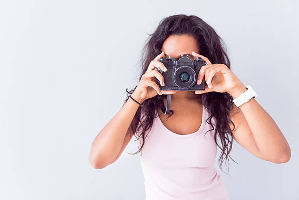 istock Pleasant woman making photos 605992788