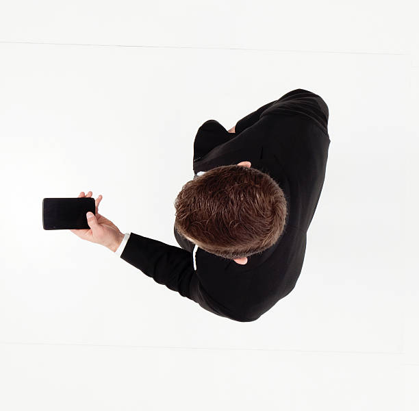 istock Above view of businessman using phone 605993948