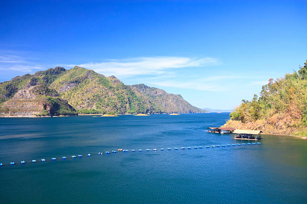 istock dam with raft and buoyancy on clear sky 605996092