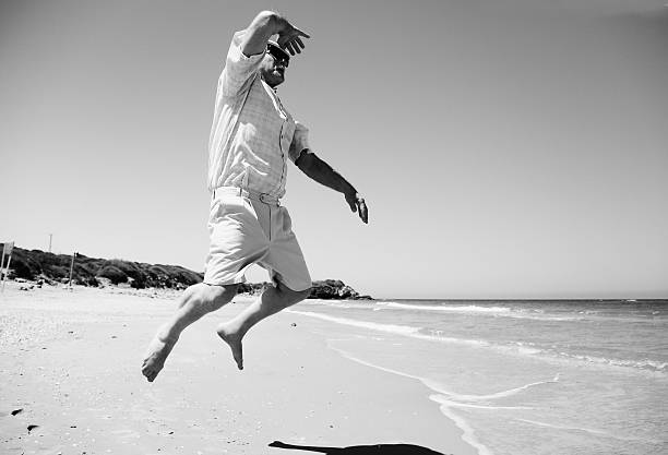 istock senior man on the beach 605999390