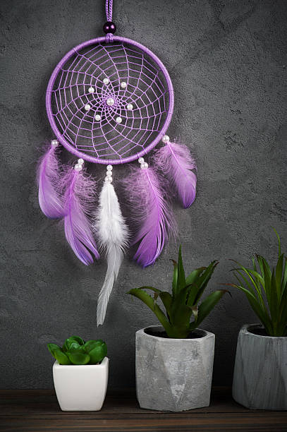 istock Puprple dream catcher on concrete background 606002076