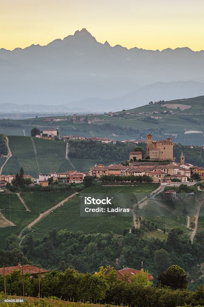 Serralunga d'Alba (Le Langhe) at sunset with Monviso Serralunga d'Alba  (Le Langhe) at sunset with Monviso in the background Alba - Italy Stock Photo