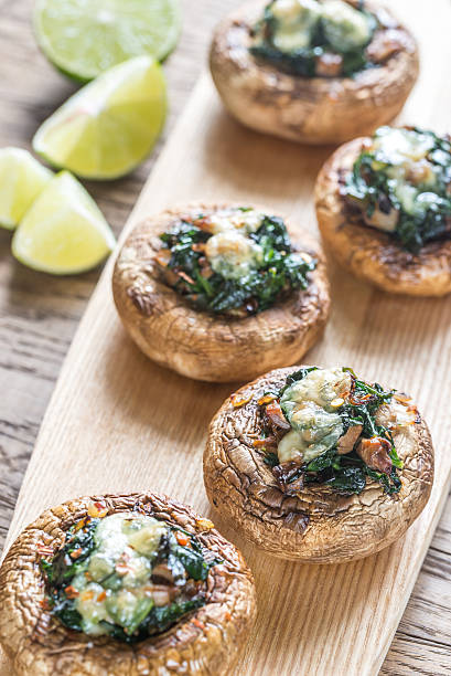 istock Baked mushrooms stuffed with spinach and cheese 606004082