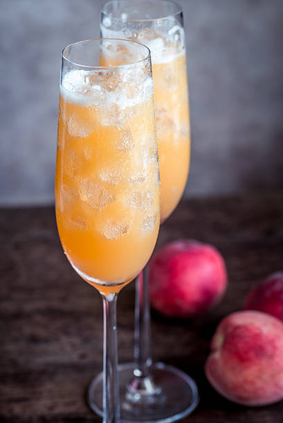 istock Two bellini cocktails with fresh peaches 606004130
