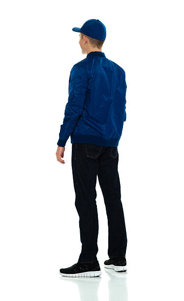 istock Rear view of male looking away 606004150