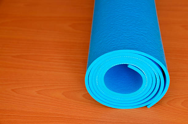 istock Blue yoga mat for exercise at home or gym. 606004496