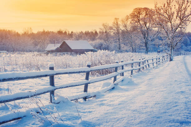istock Rural house with a fence in winter 606005208