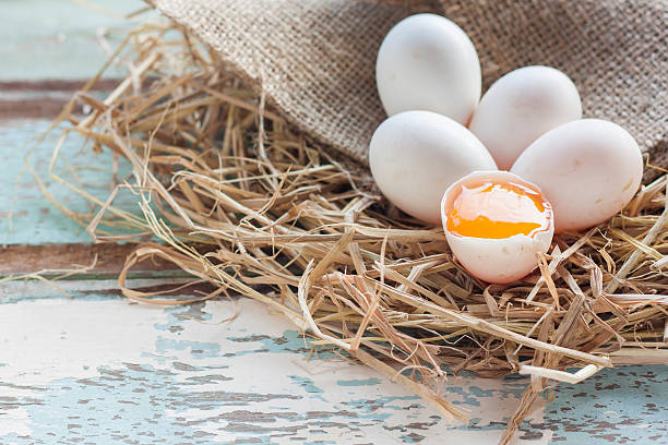 istock Organic white eggs on vintage wooden background. 606006056