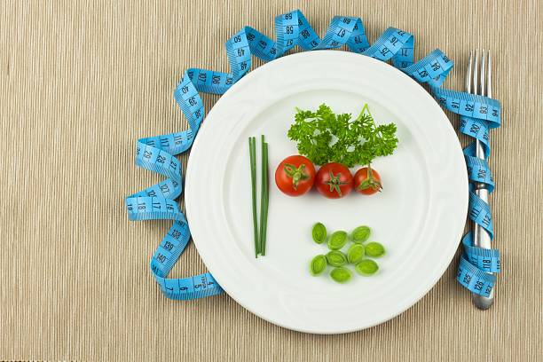 istock Strict diet against obesity. Dietary vegetable diet. 606007292