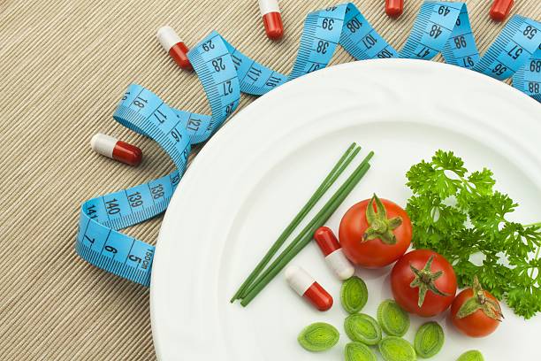 istock Strict diet against obesity. Dietary vegetable diet. 606007574