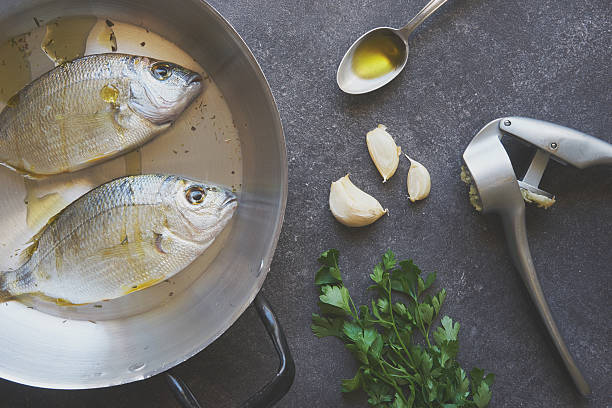 istock Fresh fishes preparing to be cooked 606007876