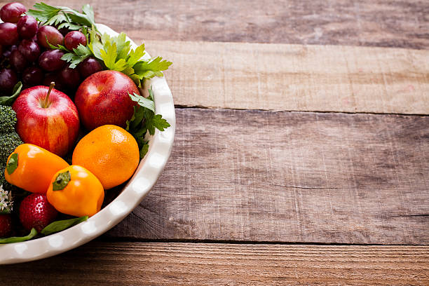 istock Organic colorful fruits, vegetables on rustic wooden table. 606008196
