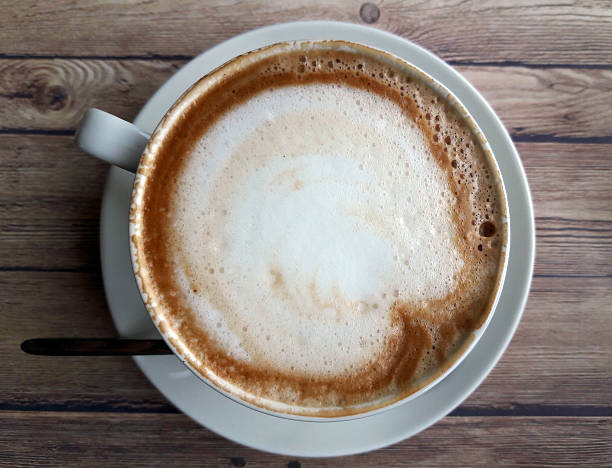 istock Cup of cappuccino top view 606010398