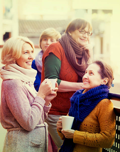 istock Senior women drinking tea at balcony 606011000