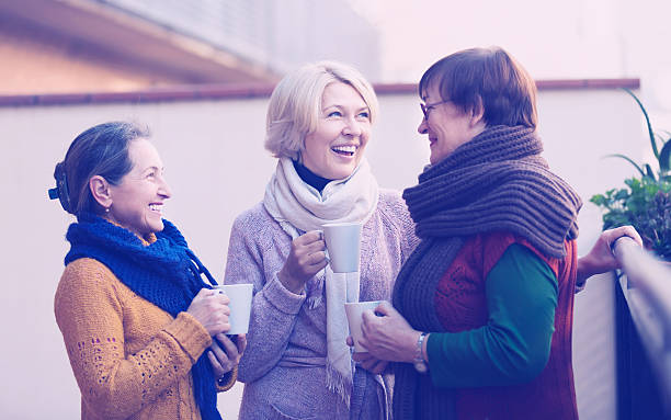 istock Senior women drinking tea at balcony 606011036