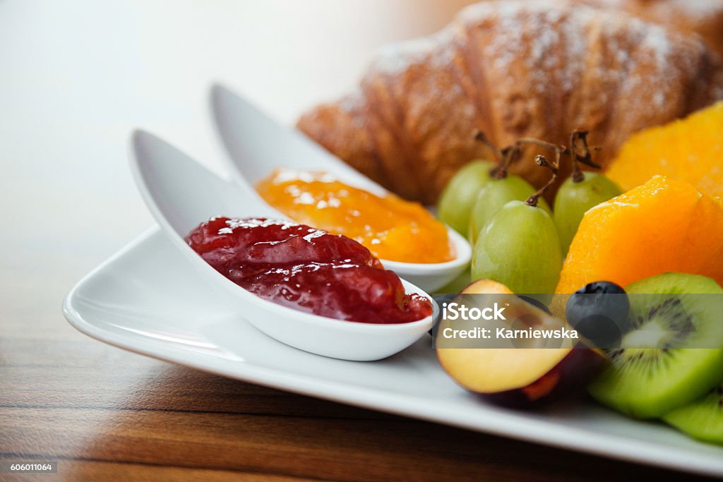 Continental breakfast with fresh fruit, jam and croissant. One of your 5-a-day. Hotel Stock Photo