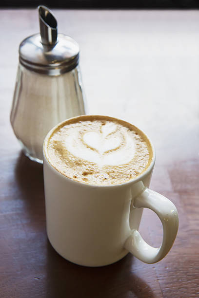 istock cappuccino coffee in cup and sugar bowl 606011556