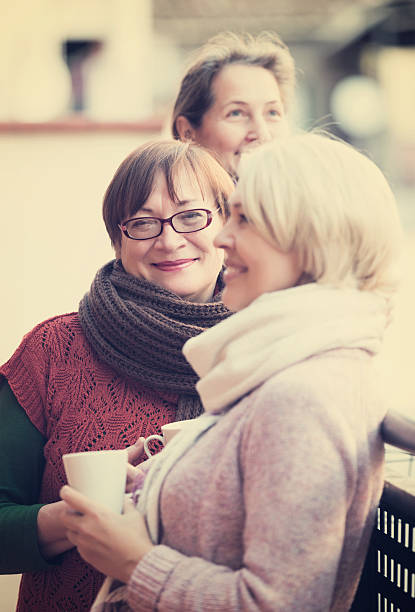 istock Pensioners having tea on terrace 606011562