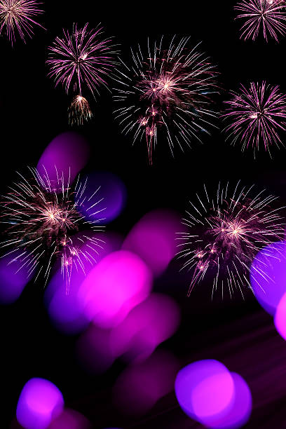istock Fireworks and defocused lights on a black background 606012334
