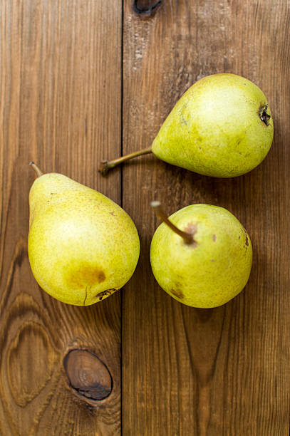 istock Some yellow pears are on the wooden table 606012534