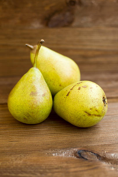 istock Some yellow pears are on the wooden table 606012546