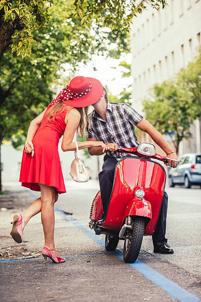 istock Young Couple Portrait with a Vintage Scooter 606015610