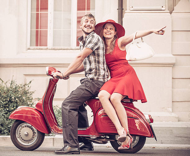 istock Young Couple Portrait with a Vintage Scooter 606015620