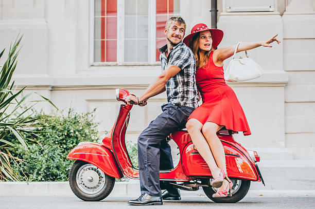 istock Young Couple Portrait with a Vintage Scooter 606015622