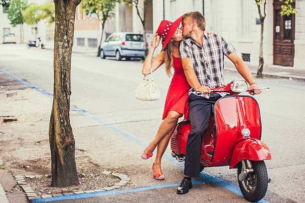 istock Young Couple Portrait with a Vintage Scooter 606015646