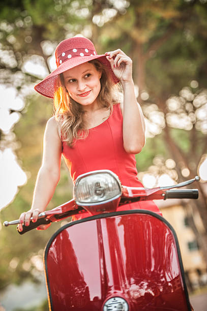 istock Young Woman on a Scooter - Vintage Style 606015666