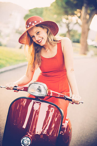 istock Young Woman on a Scooter - Vintage Style 606015668