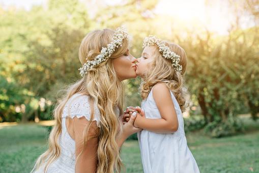 Photo of happy mother and her little daughter