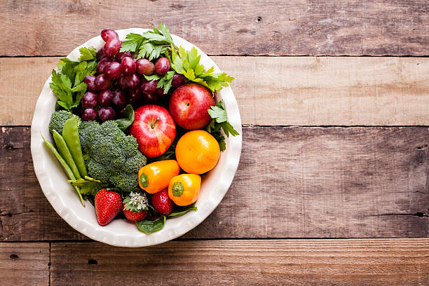 istock Organic colorful fruits, vegetables on rustic wooden table. 606016920