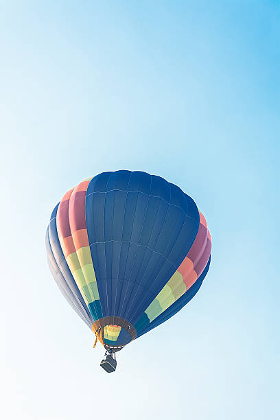 istock Hot balloon flying in the blue sky 606017014