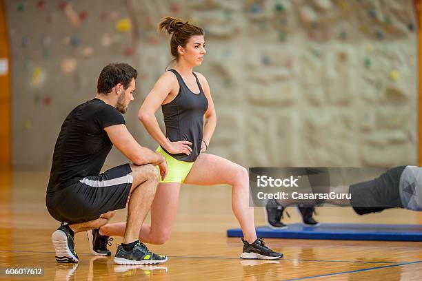 Personal Trainer Checking The Exercise Execution Stock Photo - Download ...