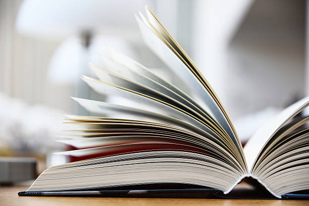istock Hardcover book lying on the table in a library 606018618