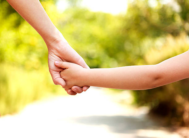 istock Mother And Daughter Walking 606018704