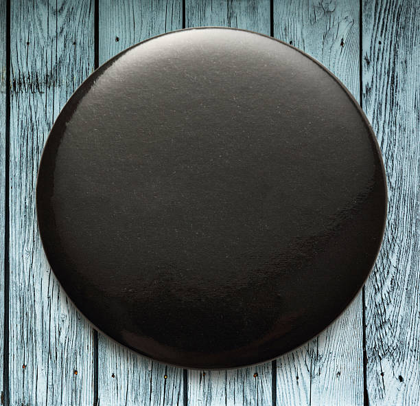 istock Blank black round badge on wood 606018786