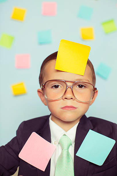 istock Young Businessman at Desk Covered with Blank Sticky Notes 606019512