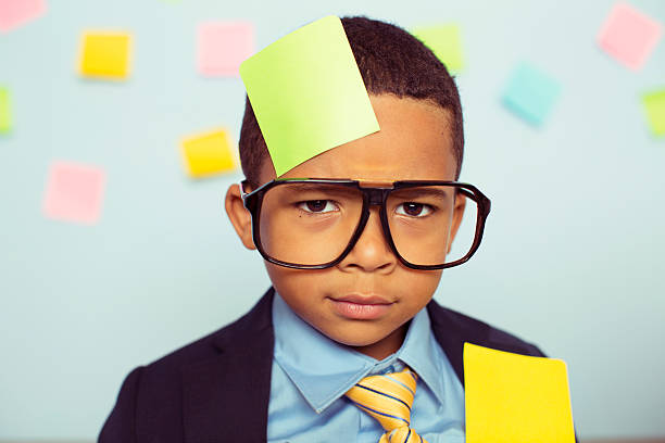 istock Young Businessman at Desk Covered with Blank Sticky Notes 606019518