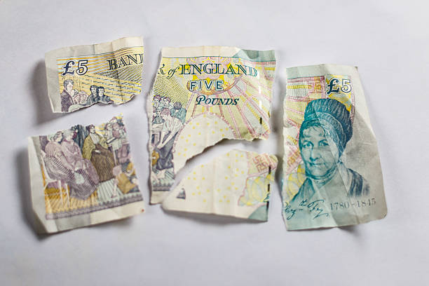 istock Old paper 5 pounds tore apart 606020704