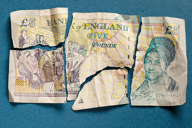 istock Old paper 5 pounds tore apart 606020740