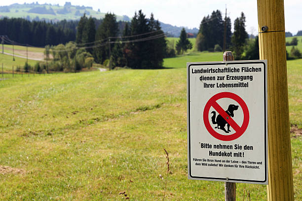 istock Sign - remove on agricultural land dog feces 606020842