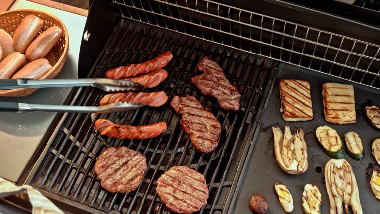 POV Man flipping meat while grilling